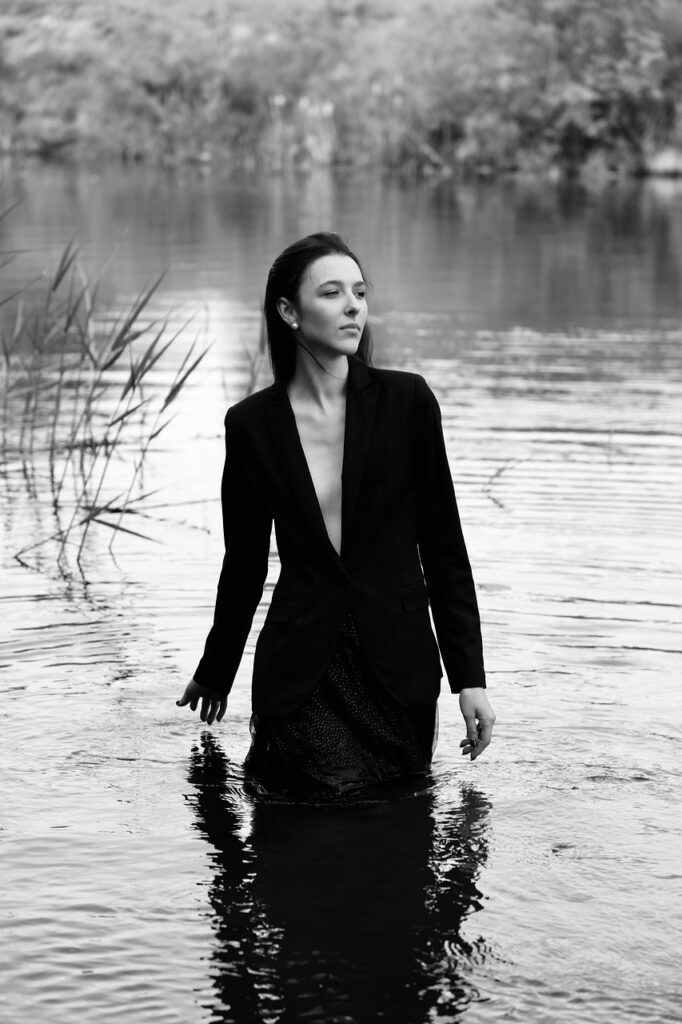 woman in water black jacket